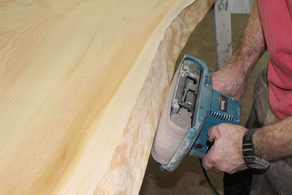 Initial sanding with belt sander